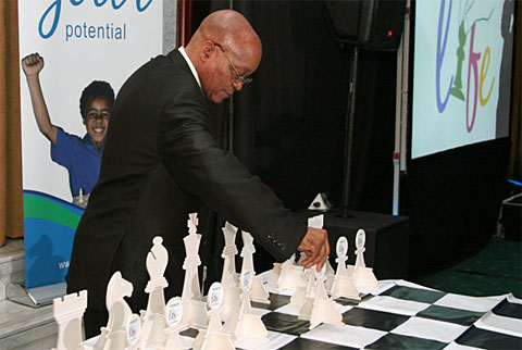 President Jacob Zuma makes ceremonial move to launch initiative. Photo by Supreme Chess Trust. 
